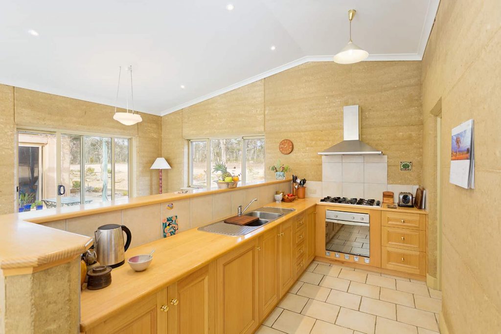 Rammed earth kitchen in home for sale